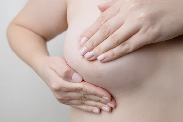 woman-hand-checking-lumps-on-her-breast-for-signs-2022-03-03-00-19-01-utc woman-hand-checking-lumps-on-her-breast-for-signs-2022-03-03-00-19-01-utc